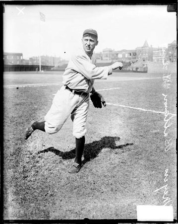 Baltimore Federal League baseball player, Meyers following through after throwing a baseball on the field at Weeghman Park - Chicago Daily News, Inc.
