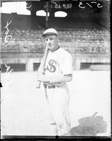 Baseball player Manda, White Sox, holding a baseball bat, standing on the field at Comiskey Park - Chicago Daily News, Inc.