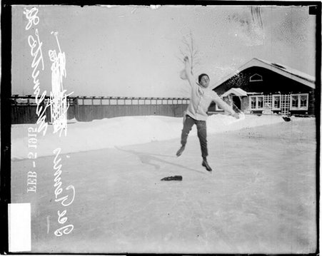 Ice tennis, man wearing skates and swinging tennis racquet over shoulder - Chicago Daily News, Inc.