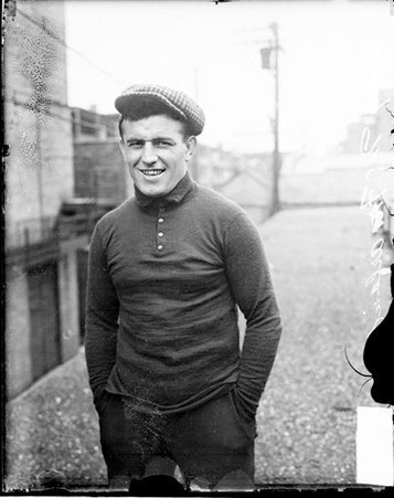 Pugilist, Packey McFarland standing with hands in pockets on roof of building - Chicago Daily News, Inc.