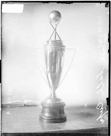 Baseball, Litzinger Cup sitting on table in front of light backdrop - Chicago Daily News, Inc.