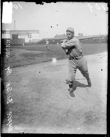 Baseball player, Red Sox, Harry Hooper swinging bat on field at Comiskey Park - Chicago Daily News, Inc.