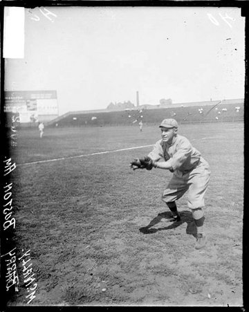 Baseball player, Red Sox, McNally catching ball on field at Comiskey - Chicago Daily News, Inc.