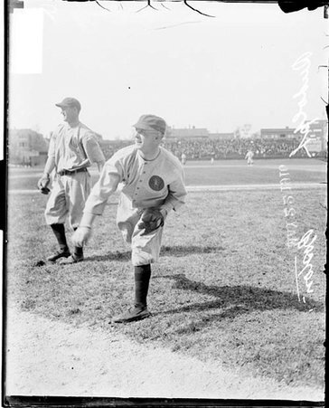 Baseball player, Boston, Rudolph standing in foul zone throwing ball on field - Chicago Daily News, Inc.