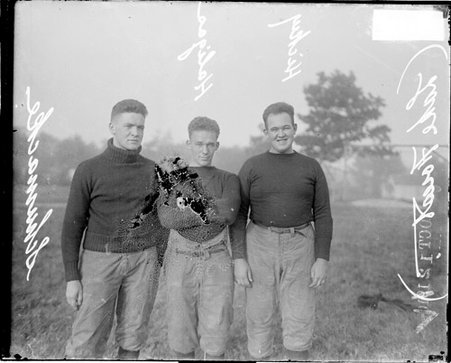 Football players, Lake Forest Academy, Schumacke, Haligas and Hickey standing on field - Chicago Daily News, Inc.