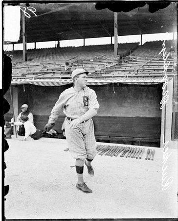 Baseball player, Brooklyn, Rucker throwing ball standing in front of dugout at Weeghman Park - Chicago Daily News, Inc.