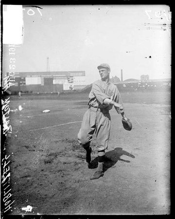 Baseball player, Red Sox, Hoblitzel throwing ball on field at Comiskey - Chicago Daily News, Inc.