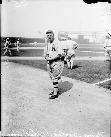 Baseball player, Ping Bodie, Philadelphia, holding bat and standing in foul zone - Chicago Daily News, Inc.