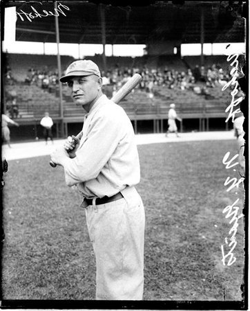 Baseball player, Niehoff, New York Giants, holding a baseball bat, standing on the field at Weeghman Field - Chicago Daily News, Inc.