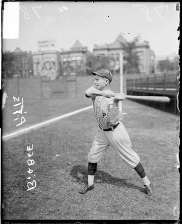 Baseball player, Pittsburgh, Bigbee swinging bat in front of grandstands on field - Chicago Daily News, Inc.