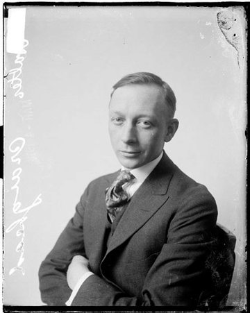 Baseball, Walter Craighead sitting in front of light backdrop wearing suit - Chicago Daily News, Inc.