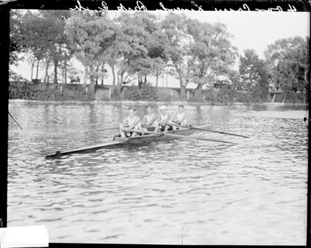 Rowing, Lincoln Park Boat Club, four rowers rowing boat in water - Chicago Daily News, Inc.