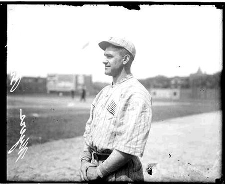 Baseball player, Myers, Brooklyn Dodgers, standing in profile on the field at Weeghman Field - Chicago Daily News, Inc.