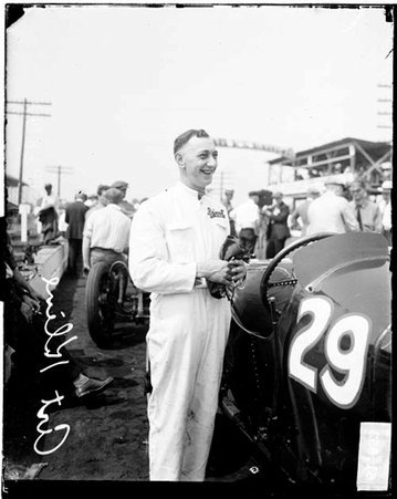 Motorist Art Kline standing next to an automobile on the side of a road - Chicago Daily News, Inc.