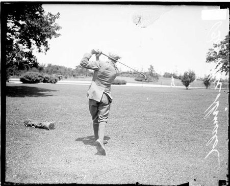Golfer, Bob McDonald, following through after a swing at a golf club - Chicago Daily News, Inc.