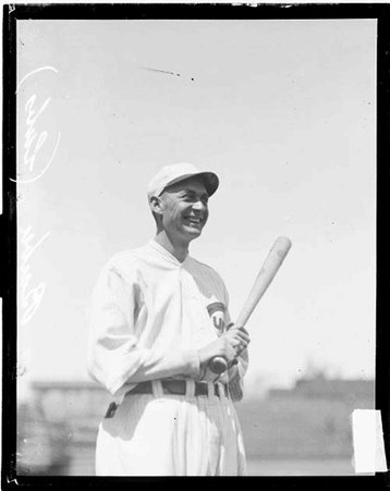 Baseball player Barber, Cubs, holding a baseball bat, standing on the field at Weeghman Field - Chicago Daily News, Inc.