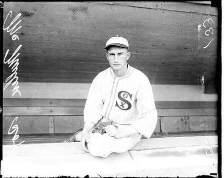 Baseball player Fred McMullin, White Sox, sitting on the ledge of a dugout in Comiskey Park - Chicago Daily News, Inc.