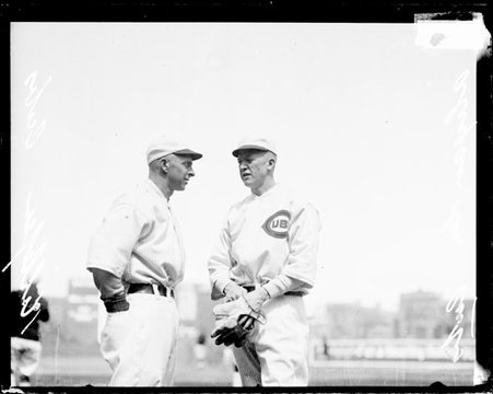 Baseball players Killefer and Alexander, Cubs, standing on the field at Weeghman Field - Chicago Daily News, Inc.