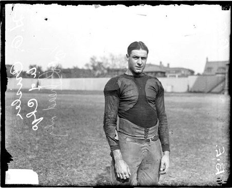 University of Chicago football player Fritz Crisler standing on the field at Stagg Field - Chicago Daily News, Inc.