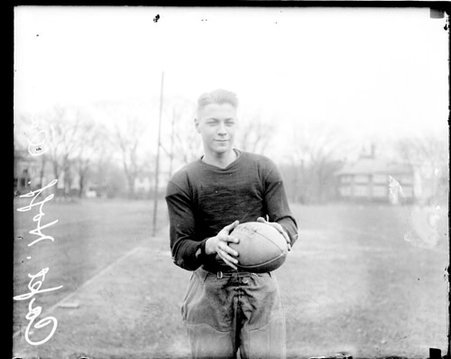 Oak Park football captain Hoff holding a football - Chicago Daily News, Inc.