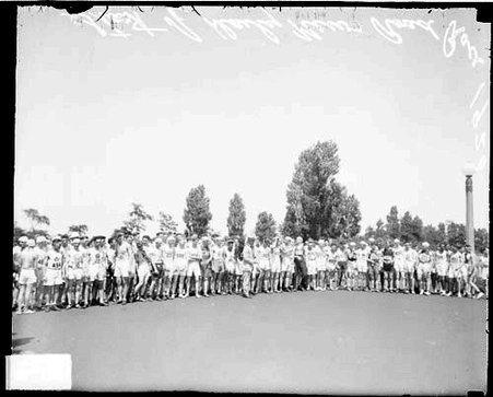 Large group of runners standing outdoors, before the start of a Chicago Daily News marathon race - Chicago Daily News, Inc.
