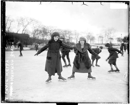 Iceskaters Kathryn Boyd and Grace Kelly standing on ice - Chicago Daily News, Inc.