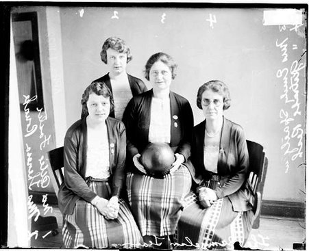 Mrs. Alice Foster, Mrs. Thomas Rourke, Mrs. Emily Saelgins (holding a bowling ball), and Mrs. Gertrude Resh in a room - Chicago Daily News, Inc.