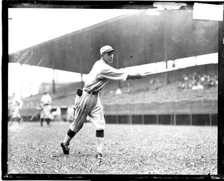 Baseball player Merkle, Cubs, swinging a baseball bat on the field at Weeghman Field - Chicago Daily News, Inc.