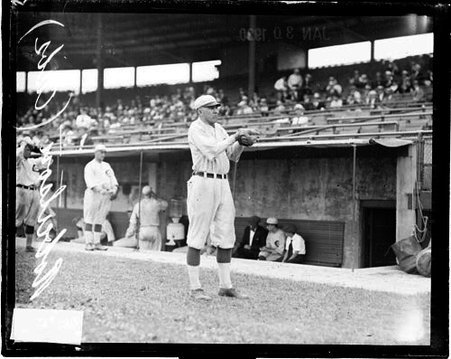 Baseball player, Dave Robertson, Cubs, holding his hands in front of him to catch a baseball on the field at Weeghman Field - Chicago Daily News, Inc.