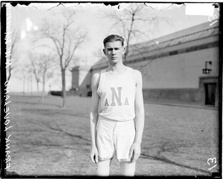 Northwestern University athlete Frank Loveland standing on an athletic field - Chicago Daily News, Inc.