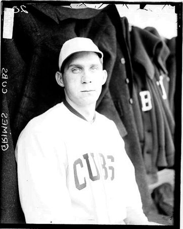 Baseball player, Grimes, Cubs, sitting in a dugout at Weeghman Field - Chicago Daily News, Inc.