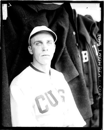 Baseball player, Twombly, Cubs, sitting in a dugout at Weeghman Field - Chicago Daily News, Inc.