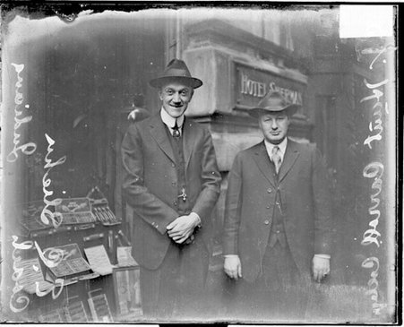 Indiana coach E. C. Sliehu and J. Hunt, of Carroll College, standing in front of the Hotel Sherman - Chicago Daily News, Inc.