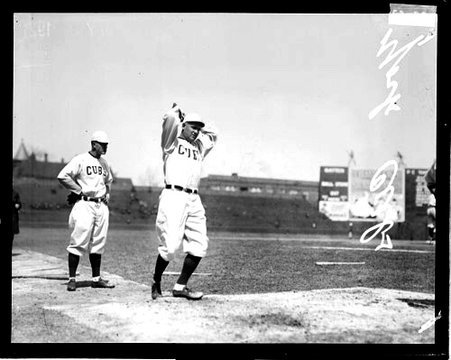 Baseball player, York, Cubs, winding up to throw a baseball, standing on the field at Weeghman Field - Chicago Daily News, Inc.