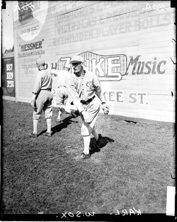 Baseball player, Karl following through after throwing a baseball in the outfield at Comiskey Park - Chicago Daily News, Inc.