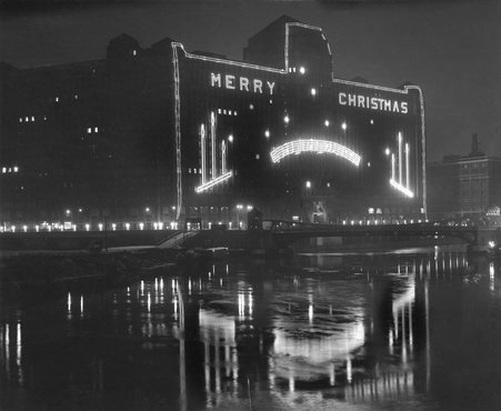 Merchandise Mart at night, decorated for Christmas holidays - Mitchell, J. Curtis
