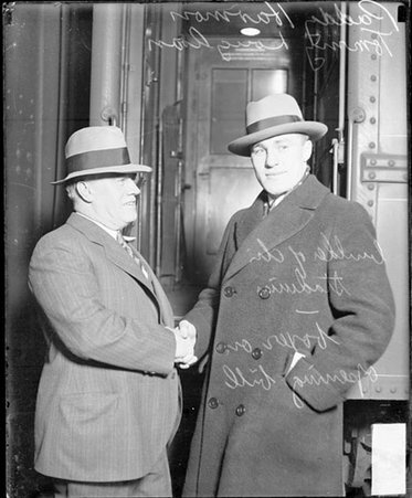 Boxing promoter, Paddy Harmon, shaking hands with pugilist, Tommy Loughran, light heavyweight champion - Chicago Daily News, Inc.