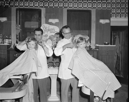 Twins get their first haircut - Chicago Daily News, Inc.