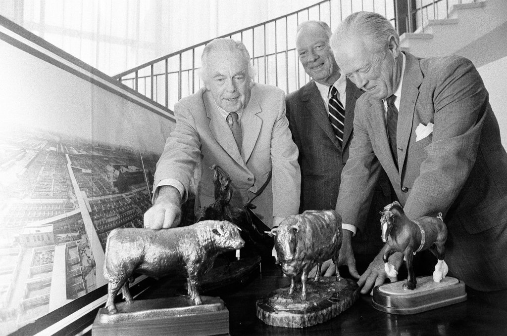 Members of the Chicago Historical Society look at memorabilia from the livestock exposition - M. Leon Lopez for Chicago Sun-Times