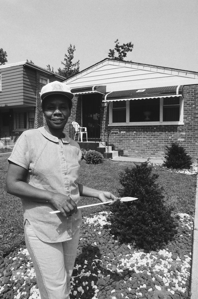 Iola Bausley poses with her home, purchased from the CHA - Chicago Sun-Times