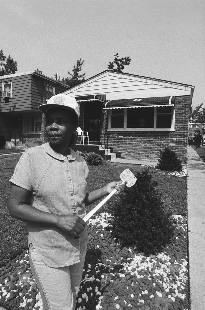 Iola Bausley poses with her home, purchased from the CHA - Chicago Sun-Times
