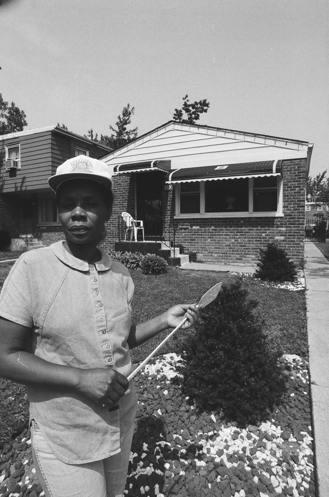 Iola Bausley poses with her home, purchased from the CHA - Chicago Sun-Times