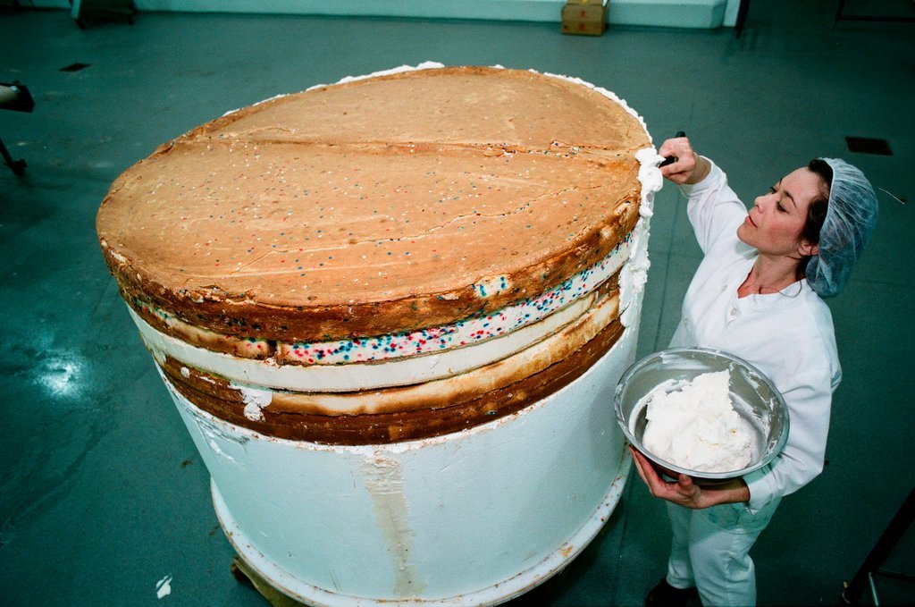 Woman posing with presidential-themed cheesecake - Chicago Sun-Times