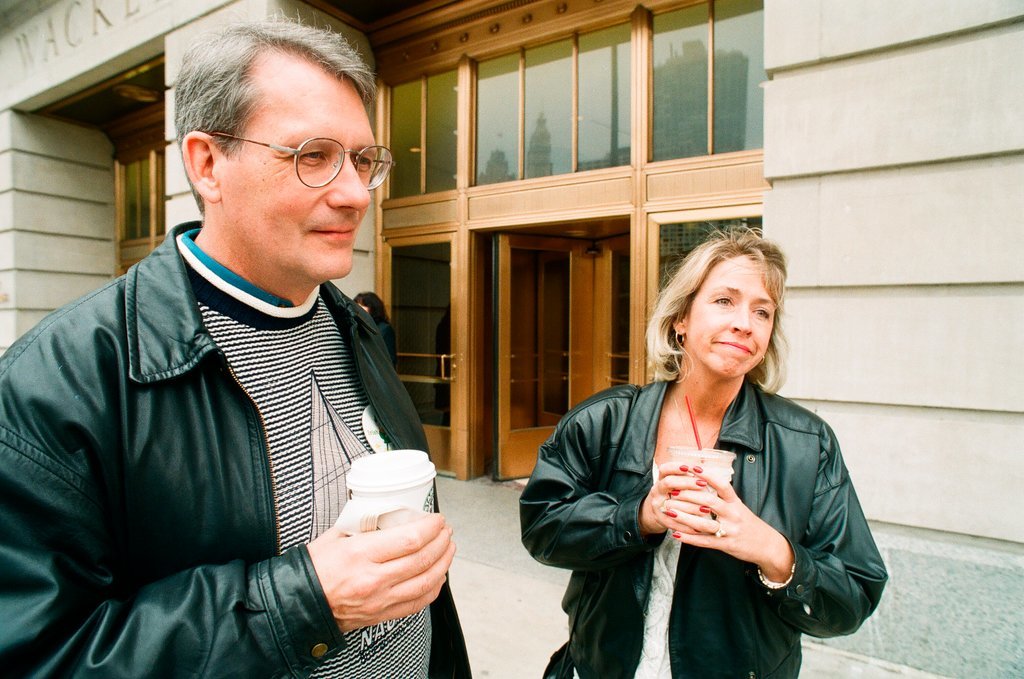 Coffee drinkers talk outside of Starbucks - Chicago Sun-Times