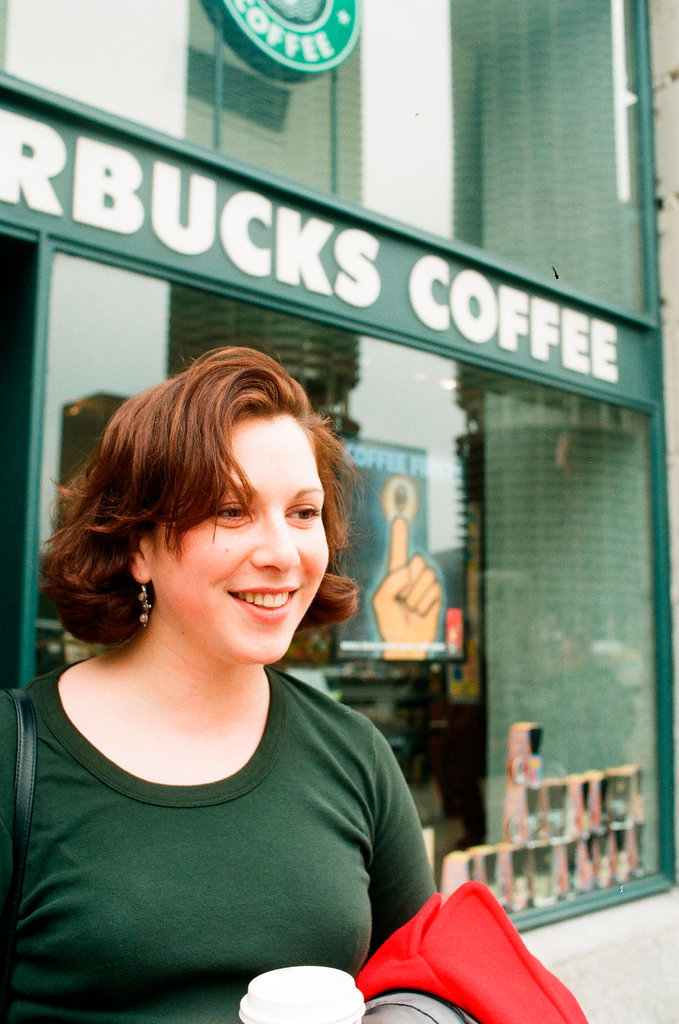 Coffee drinkers talk outside of Starbucks - Chicago Sun-Times