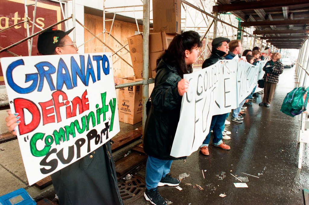 Demonstrators standing outside of Goldblatt's building - Chicago Sun-Times