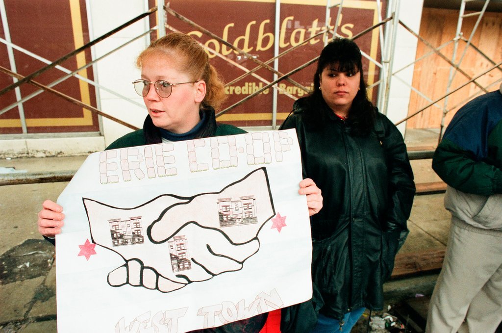 Demonstrators standing outside of Goldblatt's building - Chicago Sun-Times