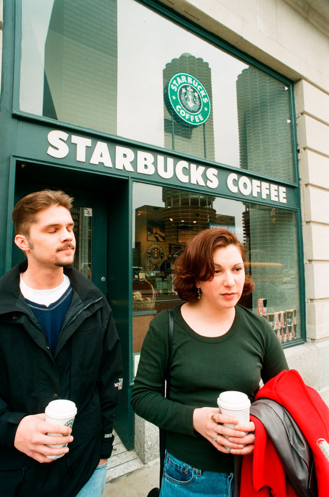 Coffee drinkers talk outside of Starbucks - Chicago Sun-Times