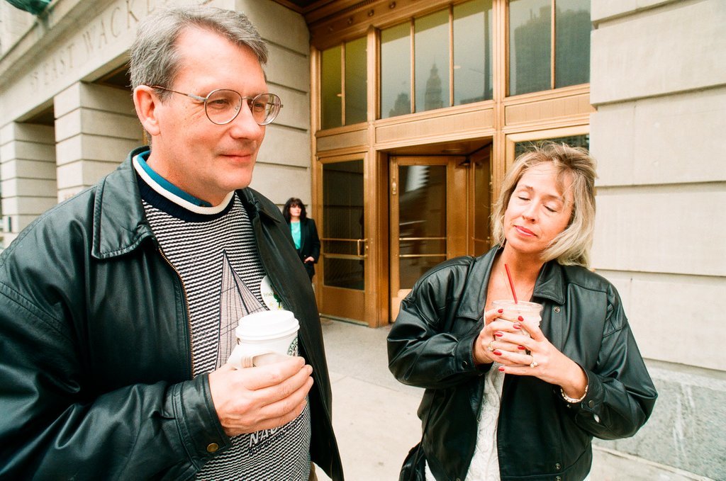 Coffee drinkers talk outside of Starbucks - Chicago Sun-Times