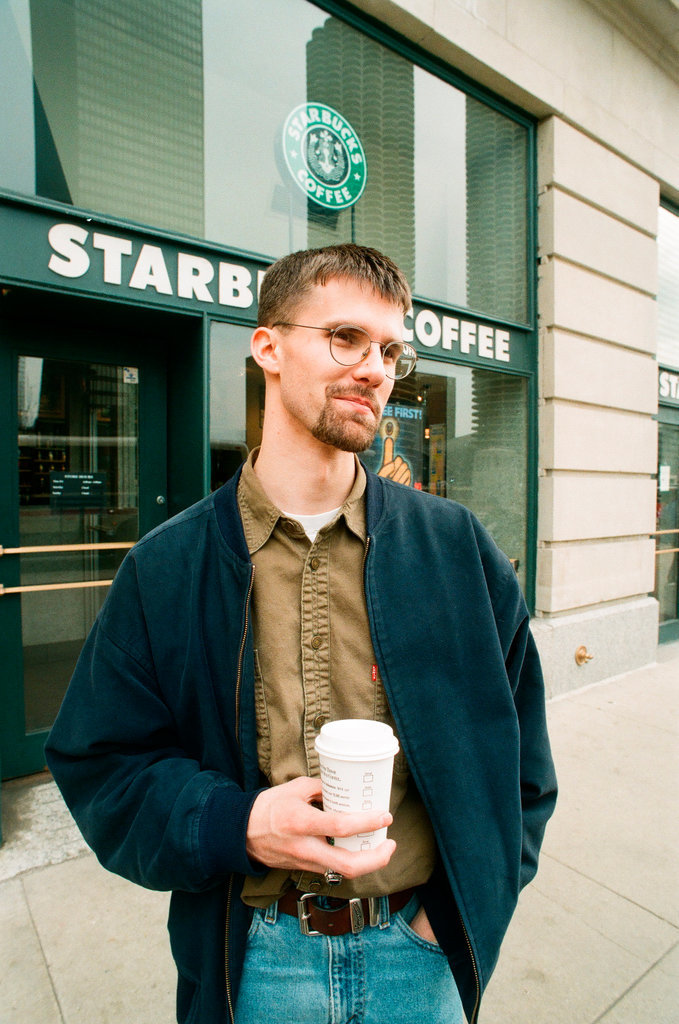 Coffee drinkers talk outside of Starbucks - Chicago Sun-Times